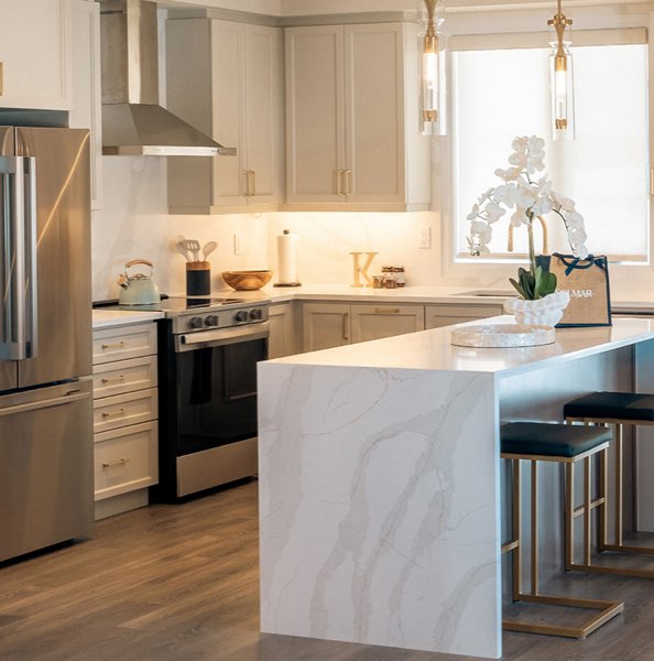 North Hill by Solmar designer kitchen with marble waterfall island and luxury finishes